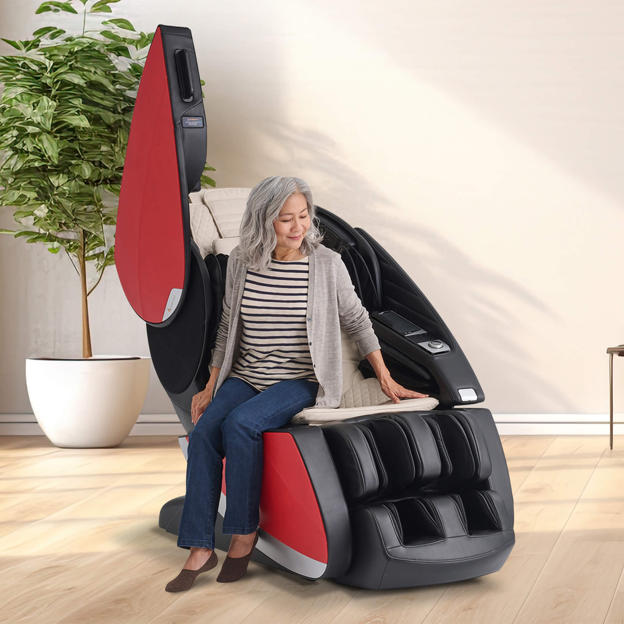 Woman sliding in to Super Novo X Massage Chair